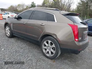 2014 Cadillac SRX Performance Collection with VIN 3GYFNCE33ES570472, listed as a IAAI auction lot 41971511 with 200,811 mi miles. Bid and sale history available at carsss.com. Image 3.