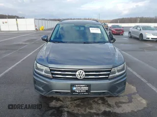 2021 Volkswagen Tiguan S with VIN 3VV1B7AX8MM016874, listed as a IAAI auction lot 41633090 with 76,857 mi miles and . Bid and sale history available at DreamBid. Image 12.
