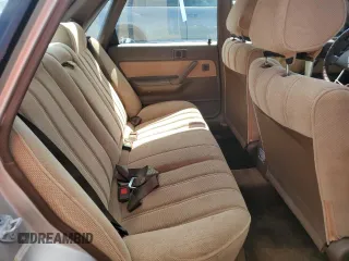 1991 Toyota Camry DLX z VIN 4T1SV21E5MU415356, wystawiony jako Copart lot #74465914 z przebiegiem 74 592 mil mil oraz Szkoda całkowita • Salvage title. Historia ofert i sprzedaży dostępna na DreamBid. Obrazek 10.