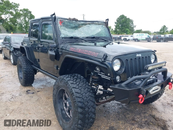 2015 Jeep Wrangler Unlimited Rubicon Hard Rock with VIN 1C4HJWFG0FL674700, listed as a IAAI auction lot 42511949 with 138,370 mi miles and . Bid and sale history available at DreamBid. Image 6.