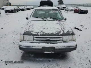 1990 Ford Tempo z VIN 1FAPP36X4LK167346, wystawiony jako Copart lot #84089494 z przebiegiem 66 291 mil mil oraz Szkody całkowita. Historia ofert i sprzedaży dostępna na DreamBid. Obrazek 5.