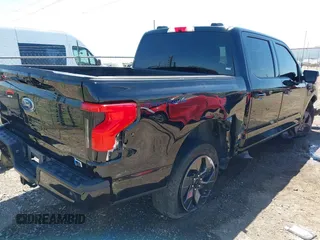 2023 Ford F-150 Lightning Pro with VIN 1FTVW1EV0PWG52297, listed as a IAAI auction lot 41730201 with 11,303 mi miles and . Bid and sale history available at DreamBid. Image 4.