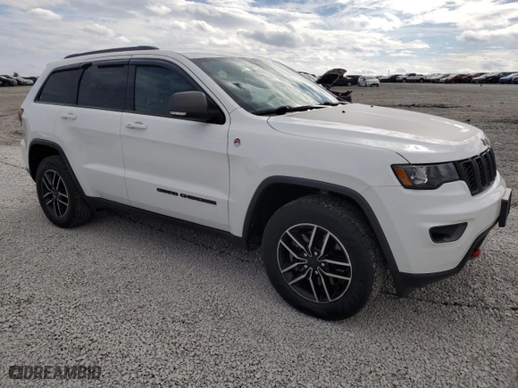 2019 Jeep Grand Cherokee Trailhawk with VIN 1C4RJFLT5KC645905, listed as a Copart auction lot 77326424 with 76,693 mi miles and Salvage Title. Bid and sale history available at carsss.com. Image 4.