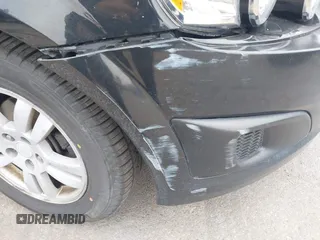 2014 Chevrolet Sonic LT z VIN 1G1JC5SB4E4153240, wystawiony jako IAAI lot #42383467 z przebiegiem 146 218 mil mil oraz . Historia ofert i sprzedaży dostępna na DreamBid. Obrazek 12.