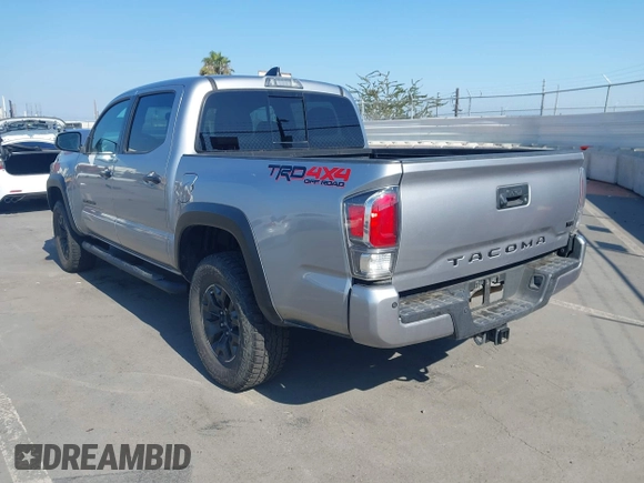 2021 Toyota Tacoma SR with VIN 5TFCZ5AN6MX270972, listed as a IAAI auction lot 42460823 with 76,062 mi miles and . Bid and sale history available at DreamBid. Image 3.