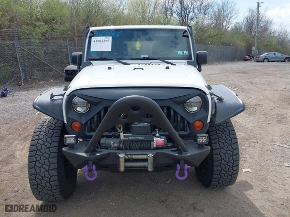2012 Jeep Wrangler Unlimited Sahara with VIN 1C4BJWEG9CL220965, listed as a IAAI auction lot 41902295 with 120,492 mi miles. Bid and sale history available at carsss.com. Image 6.
