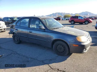 2005 Hyundai Accent GLS with VIN KMHCG45C95U665574, listed as a Copart auction lot 82603804 with 154,187 mi miles and Salvage Title. Bid and sale history available at carsss.com. Image 4.