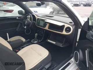 2019 Volkswagen Beetle S with VIN 3VW5DAAT4KM504847, listed as a IAAI auction lot 41582981 with 54,546 mi miles and . Bid and sale history available at DreamBid. Image 5.