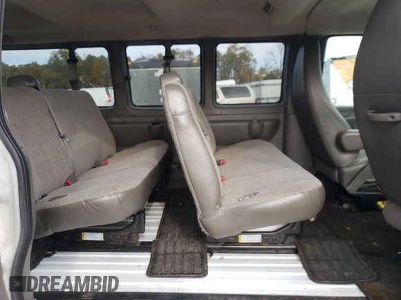 2014 Chevrolet Express Passenger LT with VIN 1GAZG1FG2E1202457, listed as a Copart auction lot 82704884 with 142,982 mi miles and Salvage title. Bid and sale history available at DreamBid. Image 11.