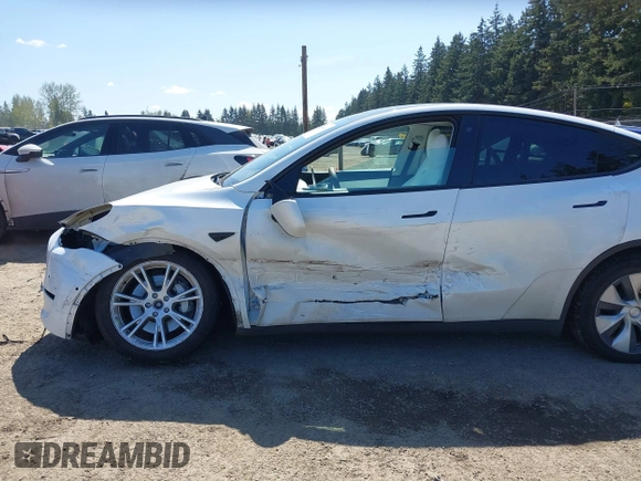 2022 Tesla Model Y Long Range z VIN 7SAYGDEE7NF418223, wystawiony jako IAAI lot #42046651 z przebiegiem 18 724 mil mil oraz . Historia ofert i sprzedaży dostępna na DreamBid. Obrazek 6.