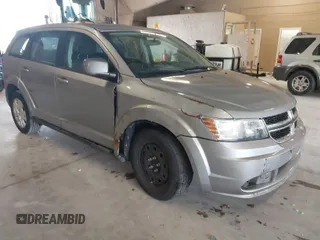 2015 Dodge Journey SE z VIN 3C4PDCAB0FT618452, wystawiony jako IAAI lot #41492052 z przebiegiem 112 219 mil mil oraz . Historia ofert i sprzedaży dostępna na DreamBid. Obrazek 1.