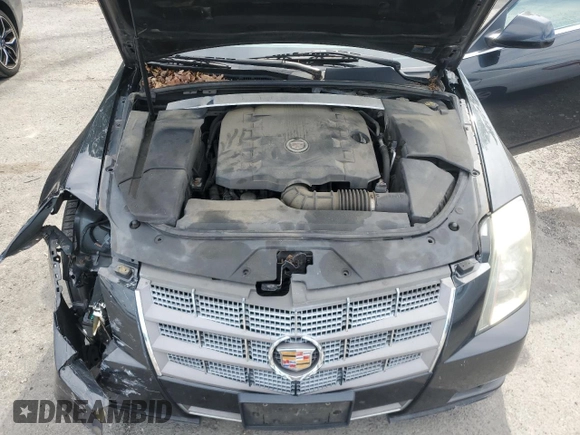 2011 Cadillac CTS Luxury z VIN 1G6DE5EY4B0102325, wystawiony jako Copart lot #57691775 z przebiegiem 157 711 mil mil oraz Szkoda całkowita • Salvage title. Historia ofert i sprzedaży dostępna na DreamBid. Obrazek 11.
