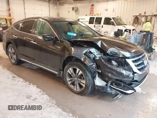 2013 Honda Crosstour EX-L z VIN 5J6TF2H56DL001143, wystawiony jako IAAI lot #42310688 z przebiegiem 132 629 mil mil oraz . Historia ofert i sprzedaży dostępna na DreamBid. Obrazek 1.