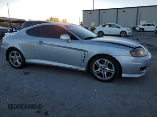 2005 Hyundai Tiburon GT z VIN KMHHN65F05U171038, wystawiony jako Copart lot #87765735 z przebiegiem 113 129 mil mil oraz Szkody całkowita. Historia ofert i sprzedaży dostępna na DreamBid. Obrazek 4.