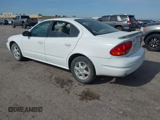 2004 Oldsmobile Alero GL1 z VIN 1G3NL52F24C176791, wystawiony jako IAAI lot #41955832 z przebiegiem 220 757 mil mil oraz . Historia ofert i sprzedaży dostępna na DreamBid. Obrazek 3.