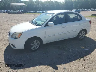 2010 Kia Rio LX with VIN KNADH4A31A6635895, listed as a Copart auction lot 61308434 with 209,016 mi miles and Salvage Title. Bid and sale history available at carsss.com. Image 1.