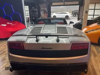 2013 Lamborghini Gallardo z VIN ZHWGU6BZ7DLA12511, wystawiony jako Copart lot #85780924 z przebiegiem 35 386 mil mil oraz Szkody całkowita. Historia ofert i sprzedaży dostępna na DreamBid. Obrazek 6.