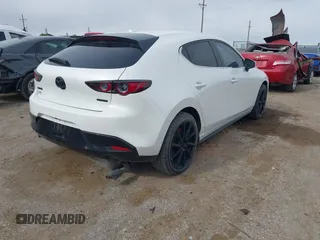 2021 Mazda 3 Premium with VIN JM1BPAML0M1302385, listed as a IAAI auction lot 41397521 with 55,907 mi miles and . Bid and sale history available at DreamBid. Image 4.