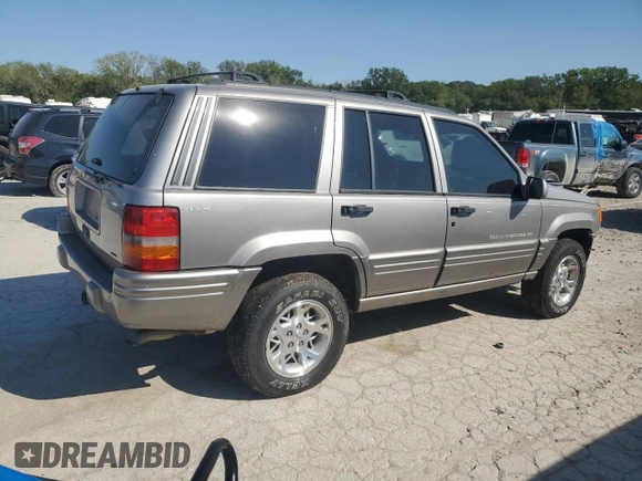 1998 Jeep Grand Cherokee Limited with VIN 1J4GZ78S5WC325148, listed as a Copart auction lot 67780424 with Not provided miles and Salvage title. Bid and sale history available at DreamBid. Image 3.