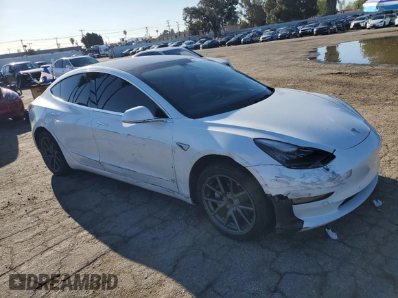 2020 Tesla Model 3 Standard Range Plus with VIN 5YJ3E1EA5LF660417, listed as a Copart auction lot 48144125 with 112,924 mi miles and Salvage Title. Bid and sale history available at DreamBid. Image 4.