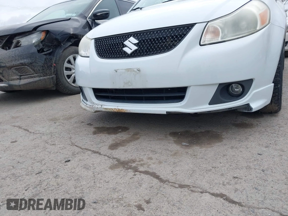 2012 Suzuki SX4 with VIN JS2YC5A52C6300339, listed as a IAAI auction lot 41829263 with 63,717 mi miles and . Bid and sale history available at DreamBid. Image 6.