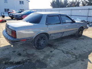 1989 Oldsmobile Cutlass z VIN 1G3AJ51W1KG334940, wystawiony jako Copart lot #42258445 z przebiegiem 97 318 mil mil oraz Szkody całkowita. Historia ofert i sprzedaży dostępna na DreamBid. Obrazek 3.