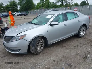2013 Lincoln MKS with VIN 1LNHL9DK4DG606551, listed as a IAAI auction lot 42343140 with 70,424 mi miles and . Bid and sale history available at DreamBid. Image 2.