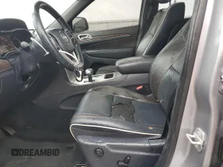 2014 Jeep Grand Cherokee Overland with VIN 1C4RJECG9EC341865, listed as a Copart auction lot 44354615 with 141,601 mi miles and Salvage Title. Bid and sale history available at carsss.com. Image 7.