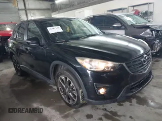 2016 Mazda CX-5 Grand Touring with VIN JM3KE4DY5G0816575, listed as a IAAI auction lot 42101340 with 180,762 mi miles and . Bid and sale history available at carsss.com. Image 1.