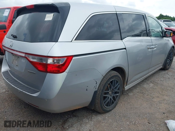 2011 Honda Odyssey Touring with VIN 5FNRL5H93BB071518, listed as a IAAI auction lot 42402421 with 227,647 mi miles and . Bid and sale history available at DreamBid. Image 4.