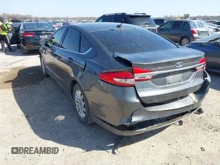 2017 Ford Fusion S with VIN 3FA6P0G72HR140903, listed as a IAAI auction lot 41782272 with 180,064 mi miles. Bid and sale history available at carsss.com. Image 3.