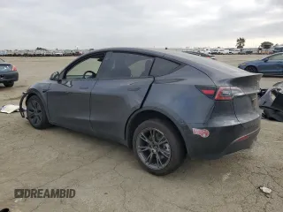 2025 Tesla Model Y Long Range with VIN 7SAYGDED6SF227475, listed as a Copart auction lot 42634345 with 3,493 mi miles and Salvage Title. Bid and sale history available at DreamBid. Image 2.