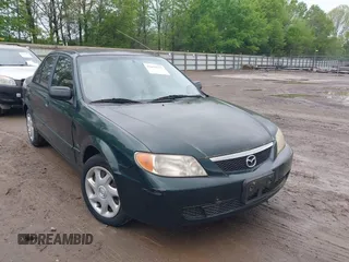 2001 Mazda Protege LX with VIN JM1BJ225110419048, listed as a IAAI auction lot 42079575 with 211,462 mi miles and . Bid and sale history available at carsss.com. Image 1.
