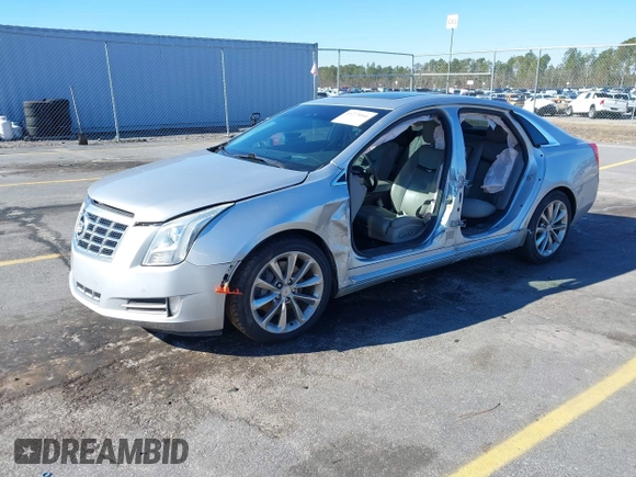 2013 Cadillac XTS Premium z VIN 2G61S5S35D9209252, wystawiony jako IAAI lot #41275066 z przebiegiem 132 311 mil mil oraz . Historia ofert i sprzedaży dostępna na DreamBid. Obrazek 2.