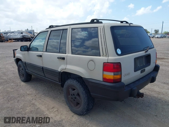 1995 Jeep Grand Cherokee Laredo with VIN 1J4GZ58Y5SC541987, listed as a IAAI auction lot 42430890 with 246,824 mi miles and . Bid and sale history available at DreamBid. Image 3.
