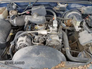 1997 GMC Yukon with VIN 1GKEK13R6VJ715421, listed as a IAAI auction lot 41811398 with 214,735 mi miles. Bid and sale history available at carsss.com. Image 10.