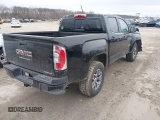 2021 GMC Canyon 4WD AT4 w/Leather with VIN 1GTG6FEN4M1103068, listed as a IAAI auction lot 41673275 with 62,254 mi miles. Bid and sale history available at carsss.com. Image 4.
