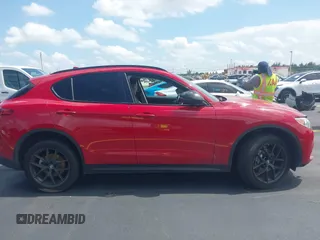 2021 Alfa Romeo Stelvio z VIN ZASPAJAN7M7D08508, wystawiony jako IAAI lot #42206372 z przebiegiem 56 459 mil mil oraz . Historia ofert i sprzedaży dostępna na DreamBid. Obrazek 14.