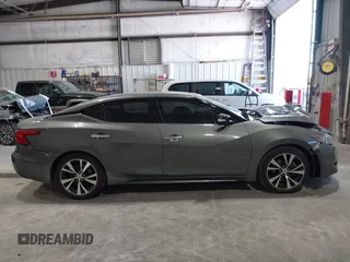 2018 Nissan Maxima SL z VIN 1N4AA6APXJC374220, wystawiony jako IAAI lot #42018130 z przebiegiem 119 776 mil mil oraz . Historia ofert i sprzedaży dostępna na DreamBid. Obrazek 13.