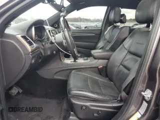 2015 Jeep Grand Cherokee Summit with VIN 1C4RJFJM7FC928257, listed as a Copart auction lot 82525714 with 148,208 mi miles and Salvage Title. Bid and sale history available at carsss.com. Image 7.