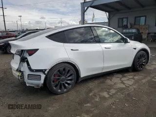 2021 Tesla Model Y Performance with VIN 5YJYGDEF4MF201815, listed as a Copart auction lot 42453075 with 76,888 mi miles and Salvage Title. Bid and sale history available at DreamBid. Image 3.