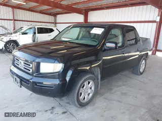 2006 Honda Ridgeline RTL with VIN 2HJYK16556H566886, listed as a IAAI auction lot 42077035 with 124,310 mi miles. Bid and sale history available at carsss.com. Image 2.