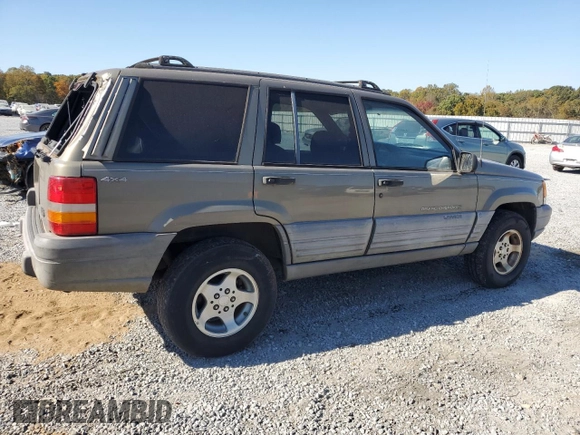 1998 Jeep Grand Cherokee Laredo with VIN 1J4GZ58S5WC165213, listed as a Copart auction lot 77611434 with 168,688 mi miles and Salvage Title. Bid and sale history available at carsss.com. Image 3.