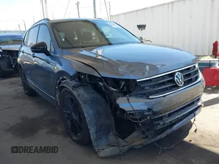 2022 Volkswagen Tiguan SE R-Line Black with VIN 3VVCB7AX8NM039730, listed as a IAAI auction lot 42313651 with 71,759 mi miles and . Bid and sale history available at DreamBid. Image 1.