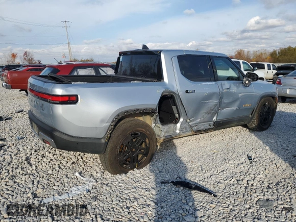 2023 Rivian R1T Adventure with VIN 7FCTGAAA2PN017170, listed as a Copart auction lot 77473014 with 28,821 mi miles and Salvage Title. Bid and sale history available at DreamBid. Image 3.