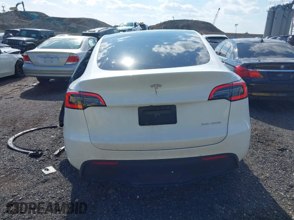 2023 Tesla Model Y Long Range with VIN 7SAYGDEE4PF780951, listed as a IAAI auction lot 41856461 with 63,317 mi miles. Bid and sale history available at carsss.com. Image 16.