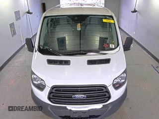 2018 Ford Transit z VIN 1FTYR1YG6JKA87506, wystawiony jako IAAI lot #42501070 z przebiegiem 167 892 mil mil oraz . Historia ofert i sprzedaży dostępna na DreamBid. Obrazek 13.