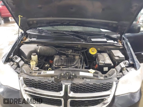 2014 Dodge Grand Caravan SXT with VIN 2C4RDGCGXER154709, listed as a IAAI auction lot 41117603 with 214,872 mi miles and . Bid and sale history available at DreamBid. Image 10.
