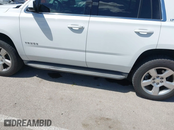 2015 Chevrolet Tahoe LT with VIN 1GNSKBKC8FR194164, listed as a IAAI auction lot 42315215 with 211,797 mi miles and . Bid and sale history available at DreamBid. Image 17.