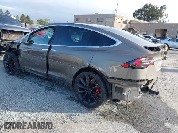 2016 Tesla Model X P90D with VIN 5YJXCAE45GF000773, listed as a IAAI auction lot 42052642 with 127,670 mi miles. Bid and sale history available at carsss.com. Image 3.